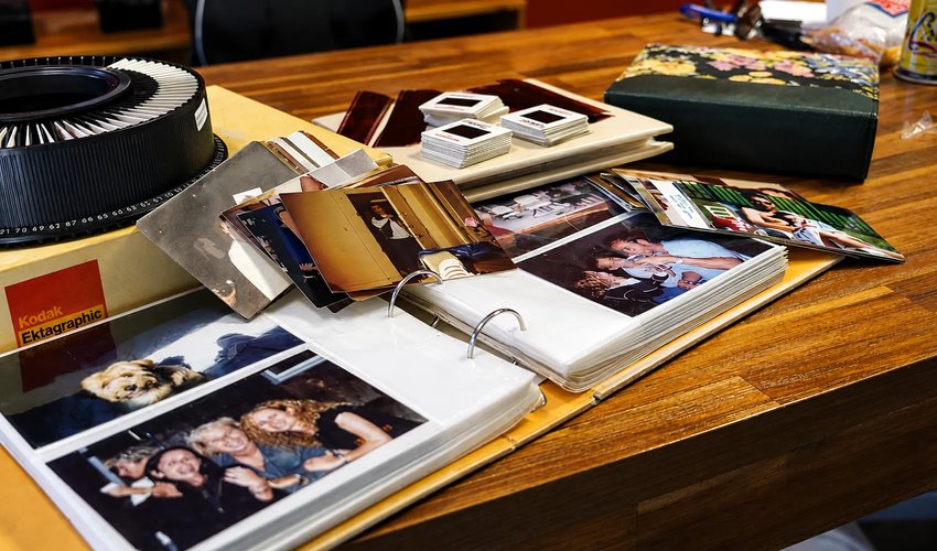Family photographs being professionally scanned at 600 DPI by Forever Studios technician