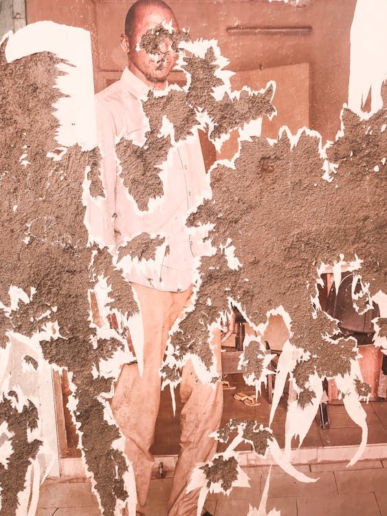 Damaged vintage photograph showing peeling emulsion and age-related deterioration
