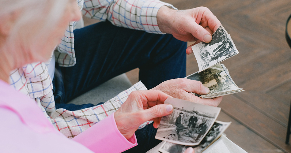 Couple looking at old family photos