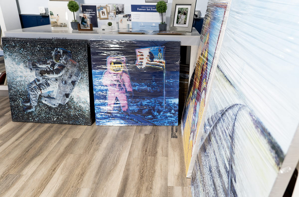 Packaging and preparing restored NASA artwork for transport to Kennedy Space Center