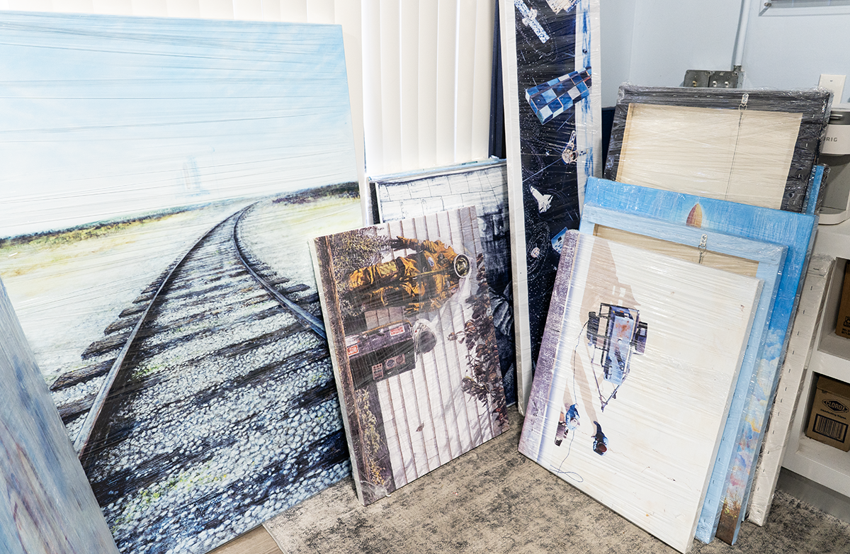 Framed restored NASA artwork piece ready for installation at Kennedy Space Center