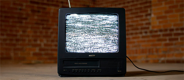 Vintage combination TV VCR unit from 1990s with wood grain finish