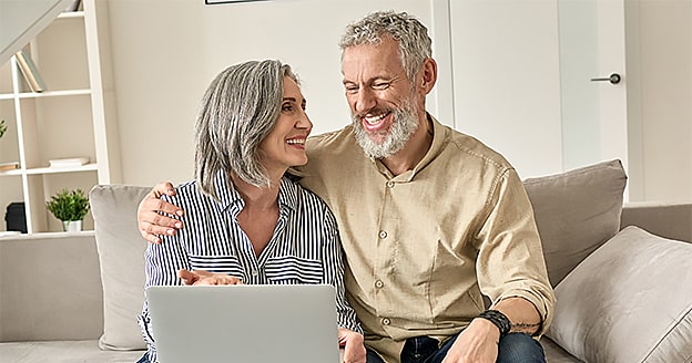 Family watching digitized VHS home movies on a modern screen