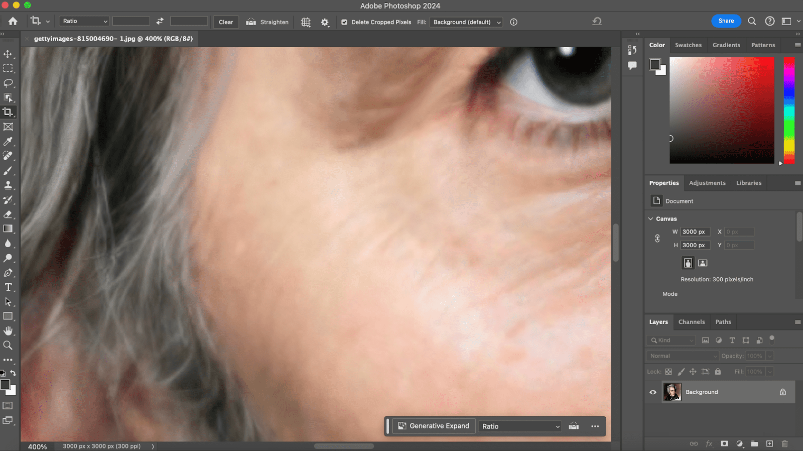 an image of a computer desktop with adobe photoshop taking up the entirety of the frame. On the canvas in the program is an extreme closeup of a restoration of american president andrew jackson, in the process of being restored