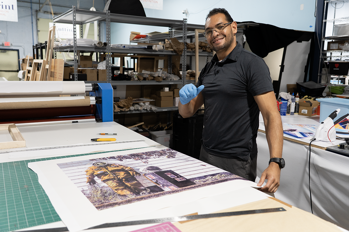 Collection of restored NASA artwork prints ready for delivery to Kennedy Space Center